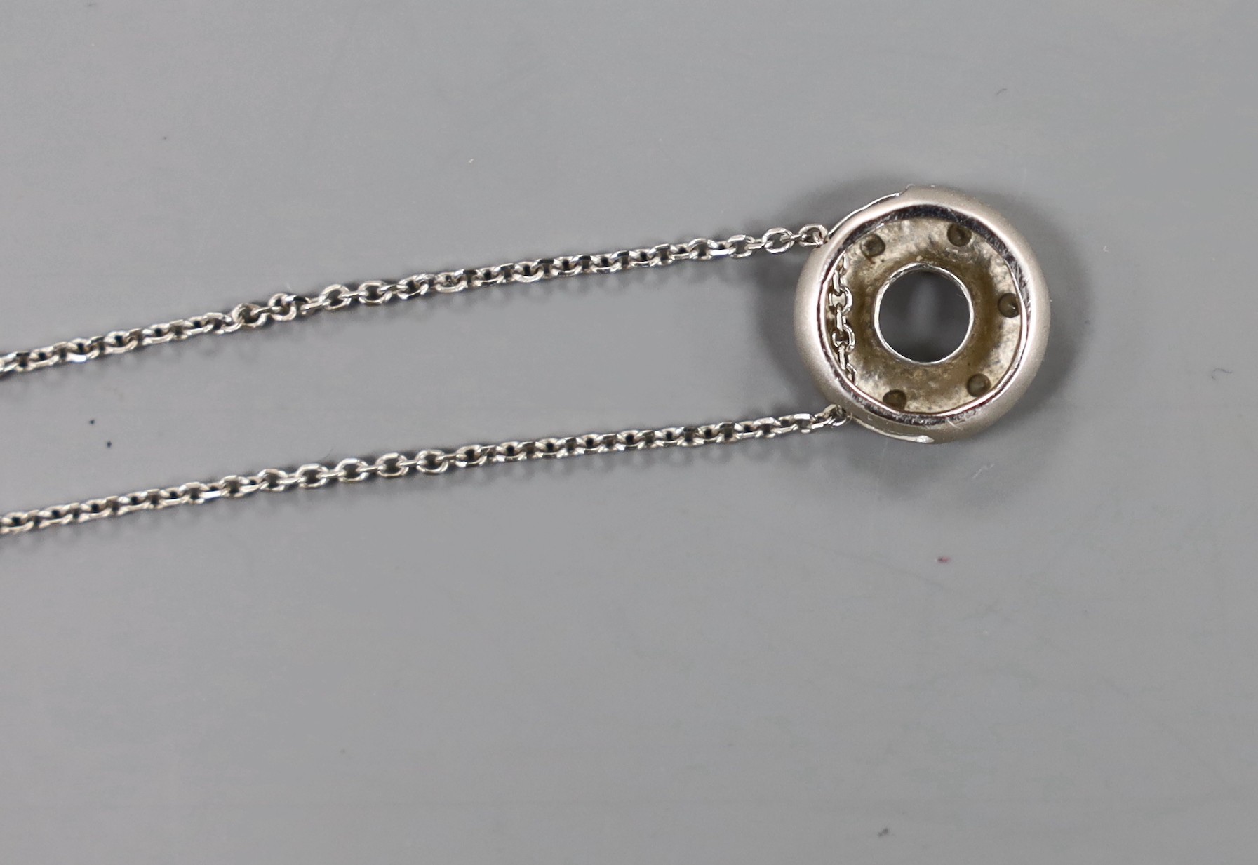 A modern 14k and diamond chip set pendant necklace, 41cm, gross weight 2.9 grams.